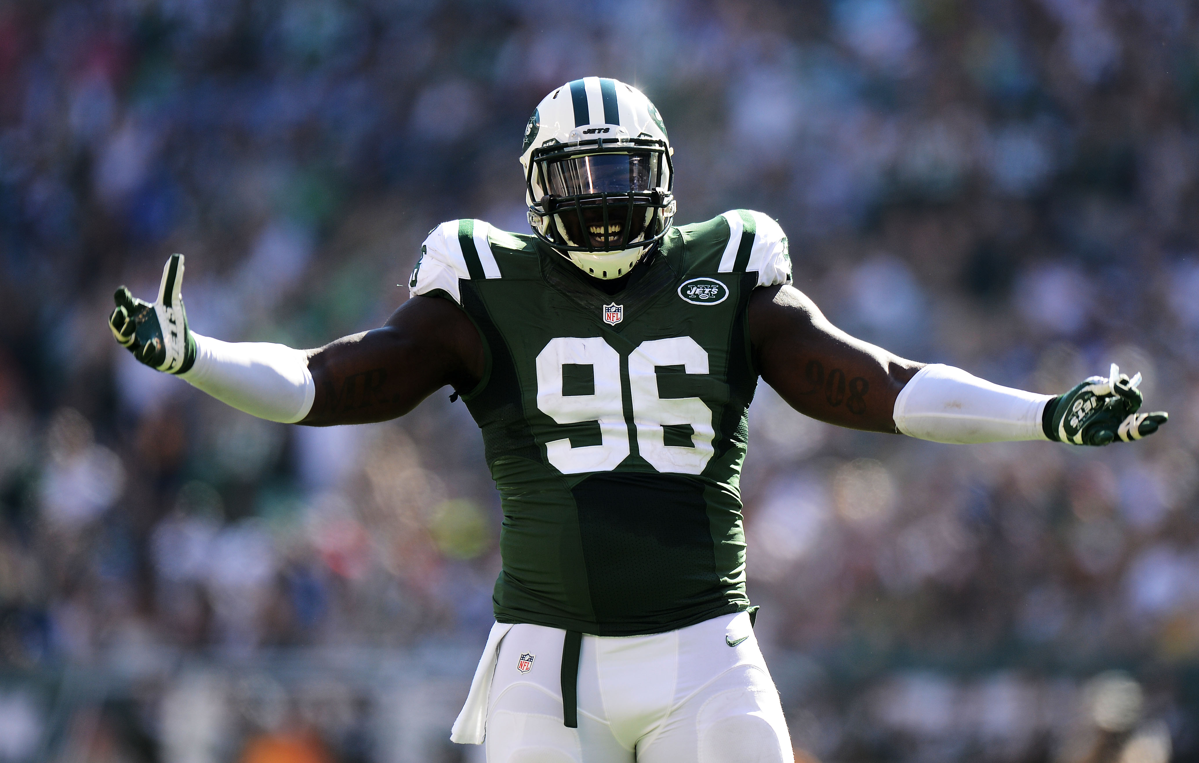 EAST RUTHERFORD, NJ - SEPTEMBER 28:   Muhammad Wilkerson #96 of the New York Jets reacts during their game against the Detroit Lions at MetLife Stadium on September 28, 2014 in East Rutherford, New Jersey.  (Photo by Ron Antonelli/Getty Images)
